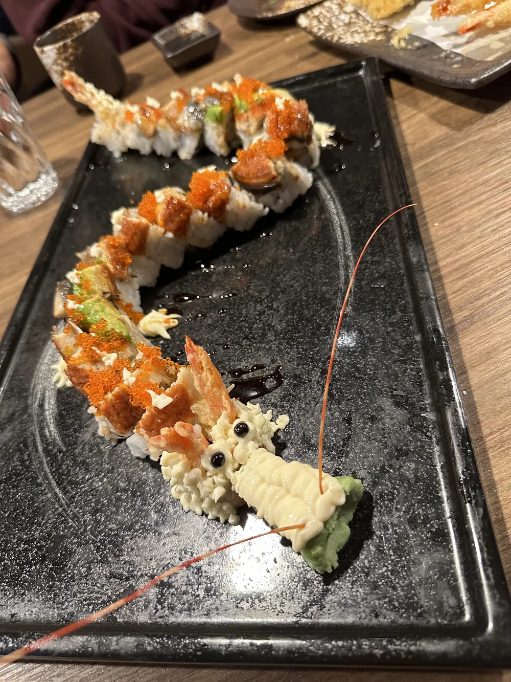 6 sushi arranged to look like a dragon