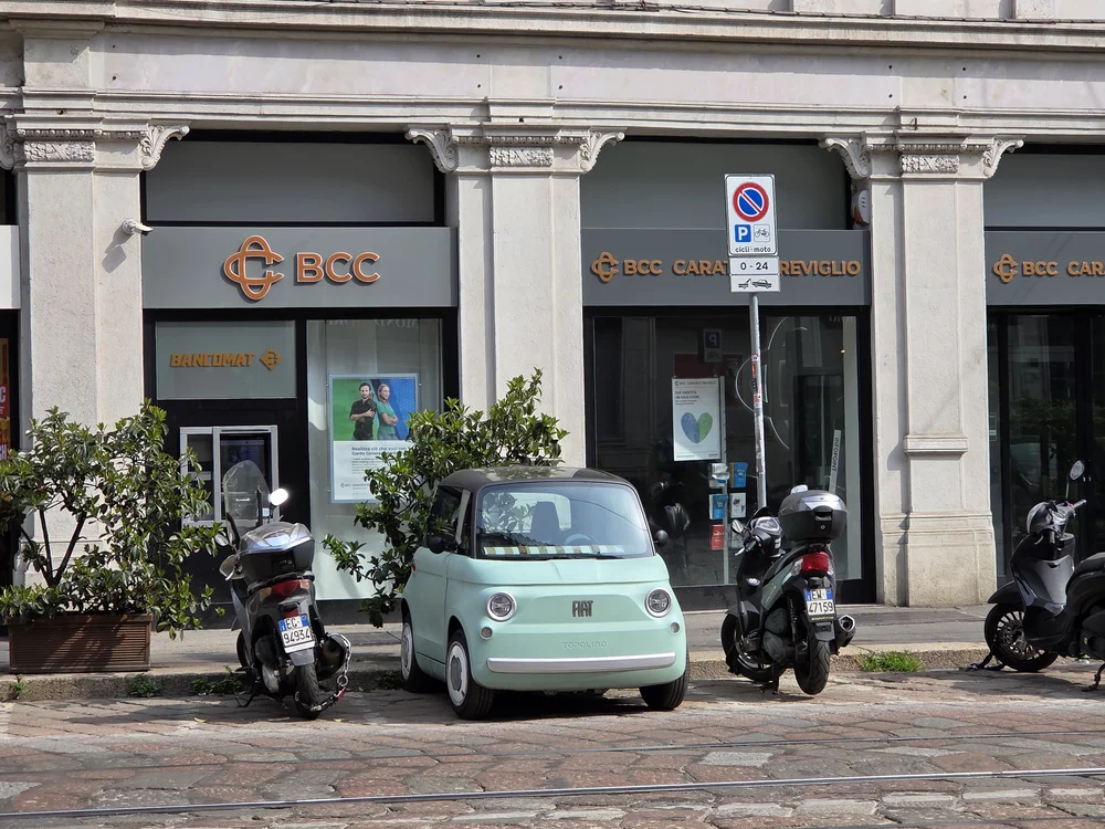 tiny fiat parked sideways