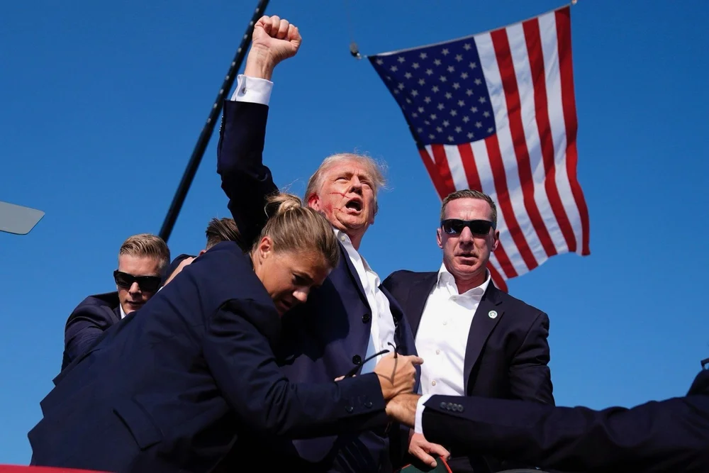 trumps bleeds with flag