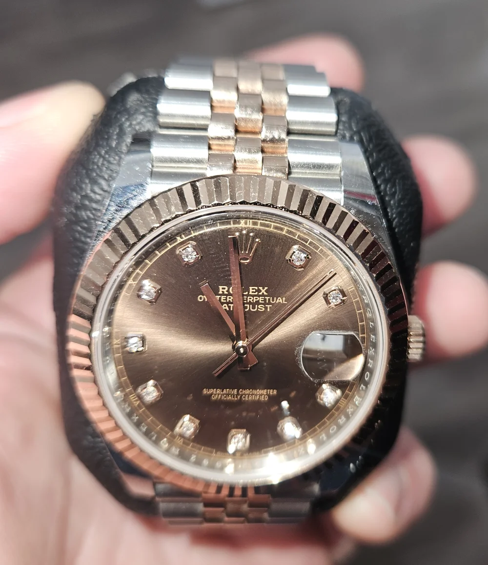rolex chocolate face with rose gold bezel 1