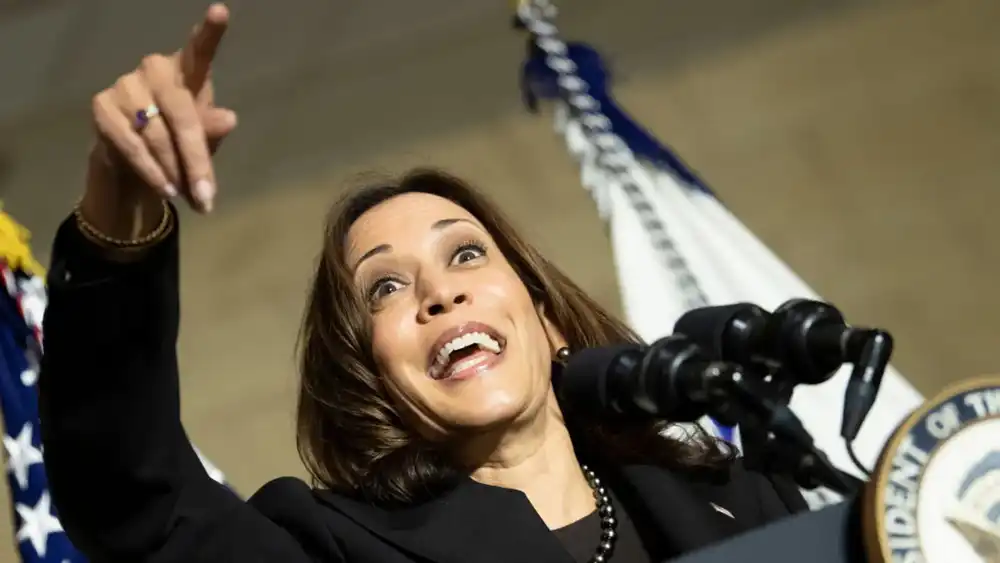 Kamala Harris pointing at the eclipse