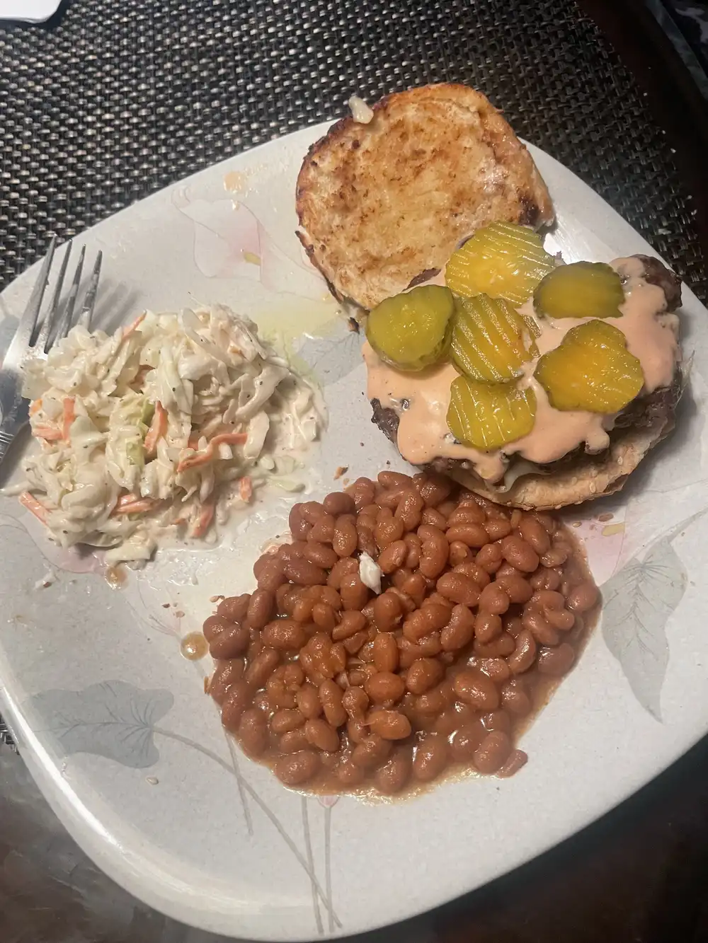 cheeseburger with homemade coleslaw and baked beans