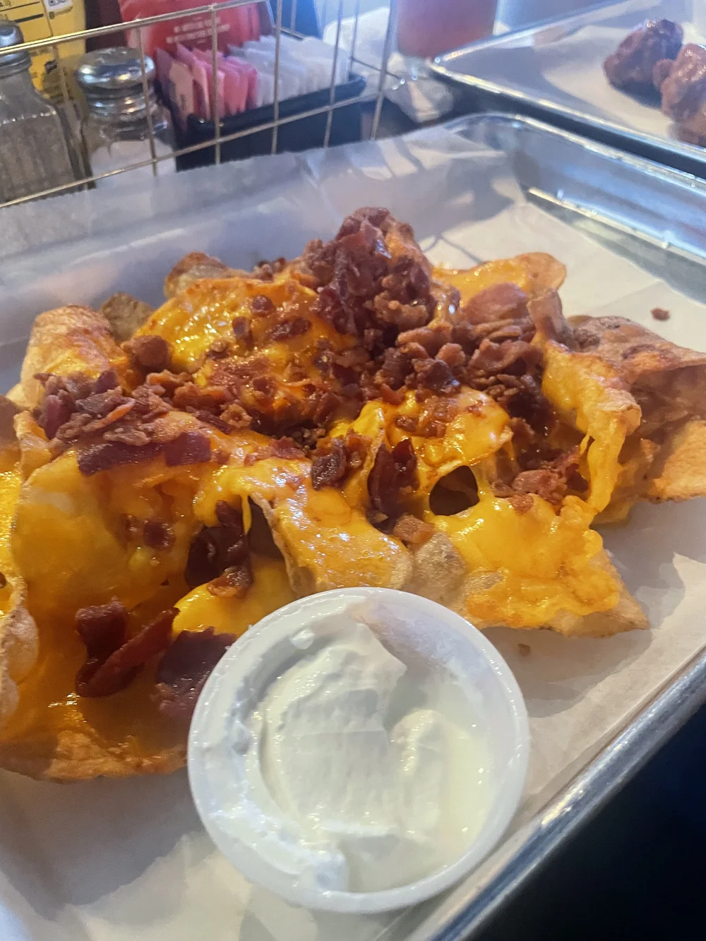 homemade chips covered in bacon and cheese