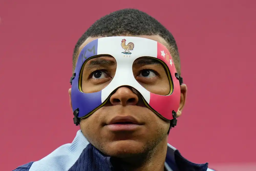 mbappe with a mask captain france