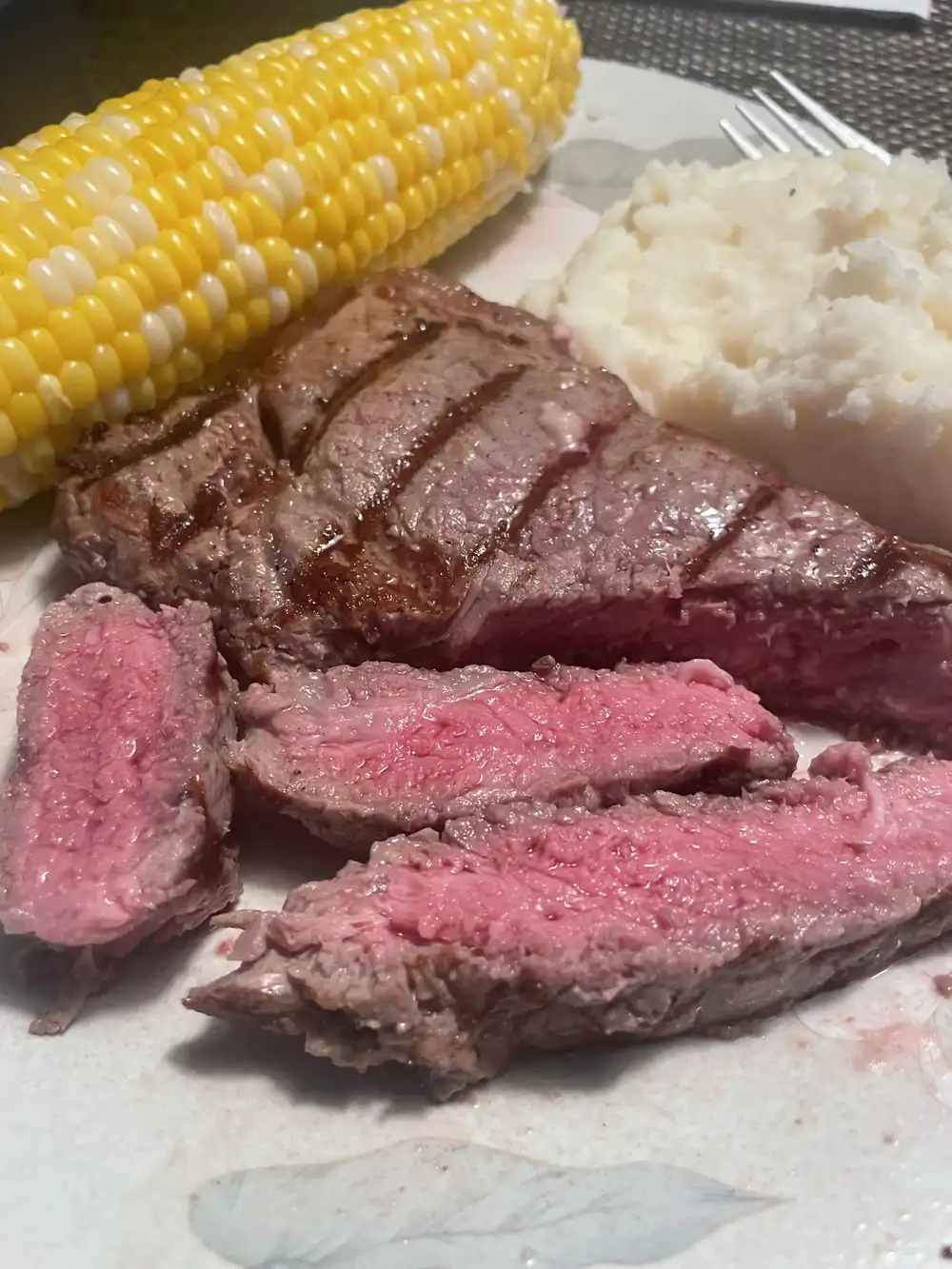 ny strip with mashed and corn cut